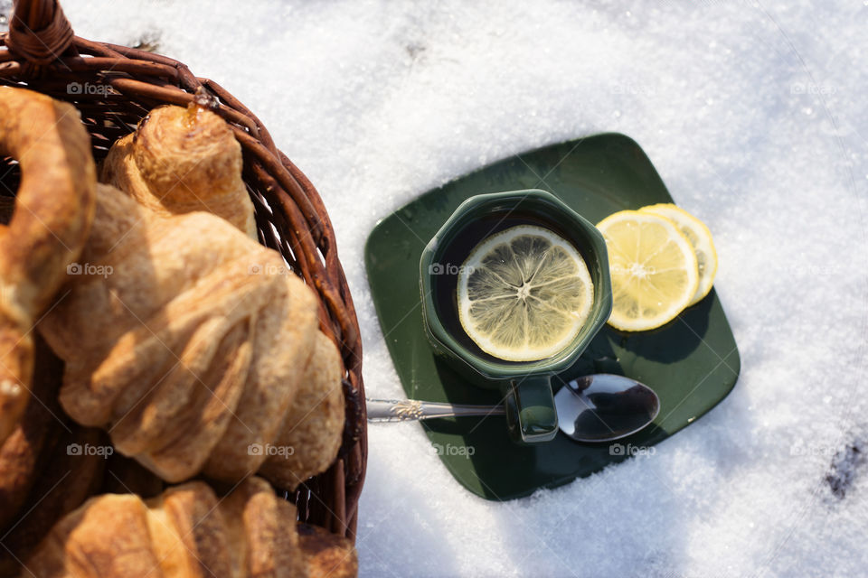 Lemon tea and croissants