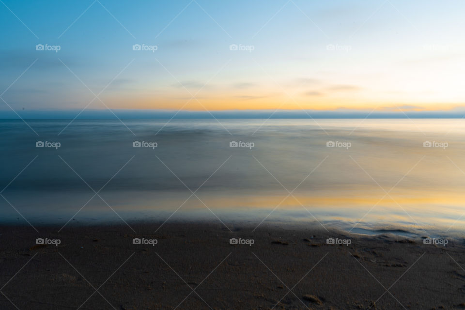 Different view of the sea during sunset.