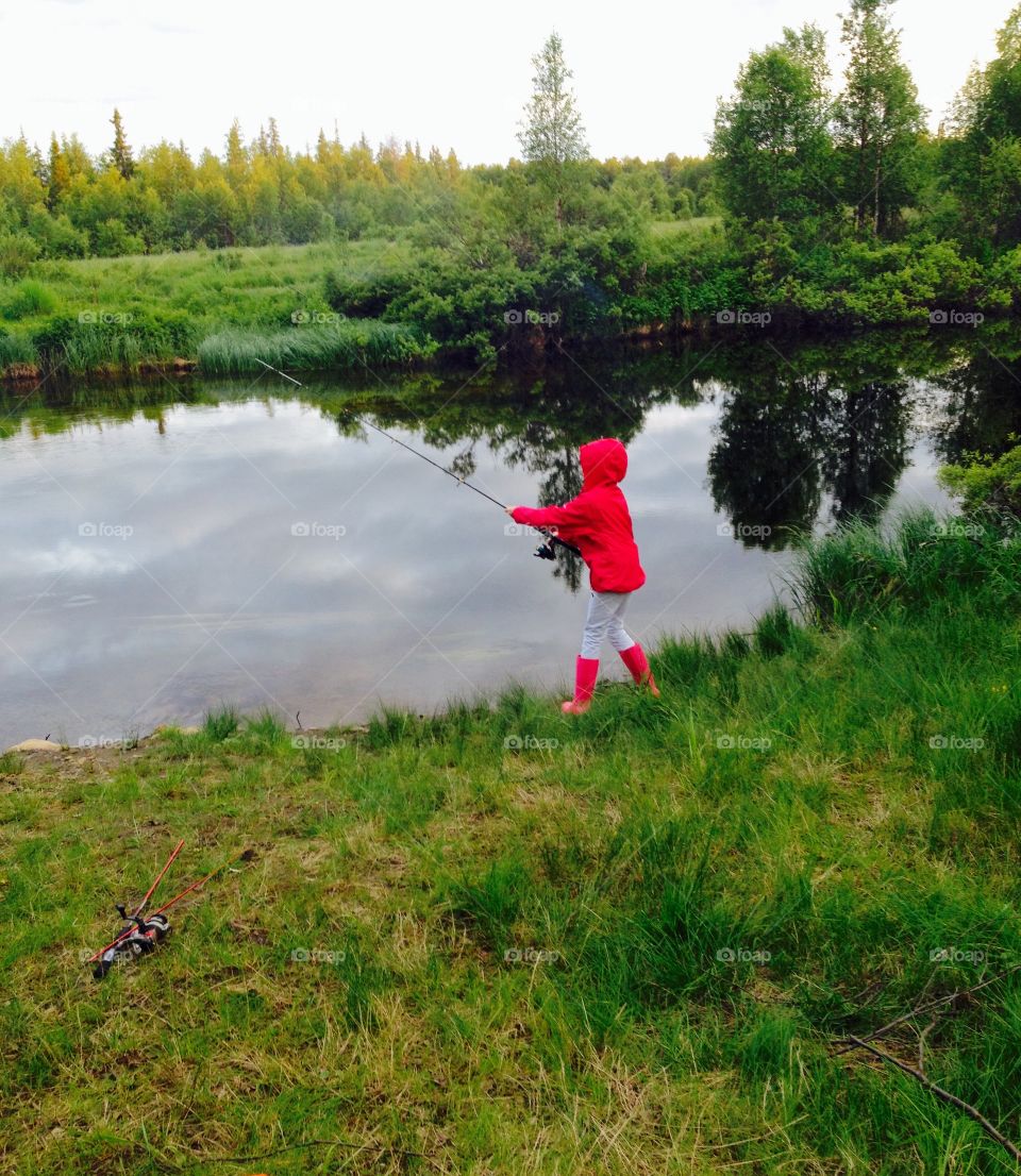 Fishing. Photo was taken in Finland, Lapland. 
My little girl loves fishing.