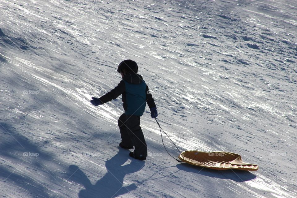 Child Tobogganing.