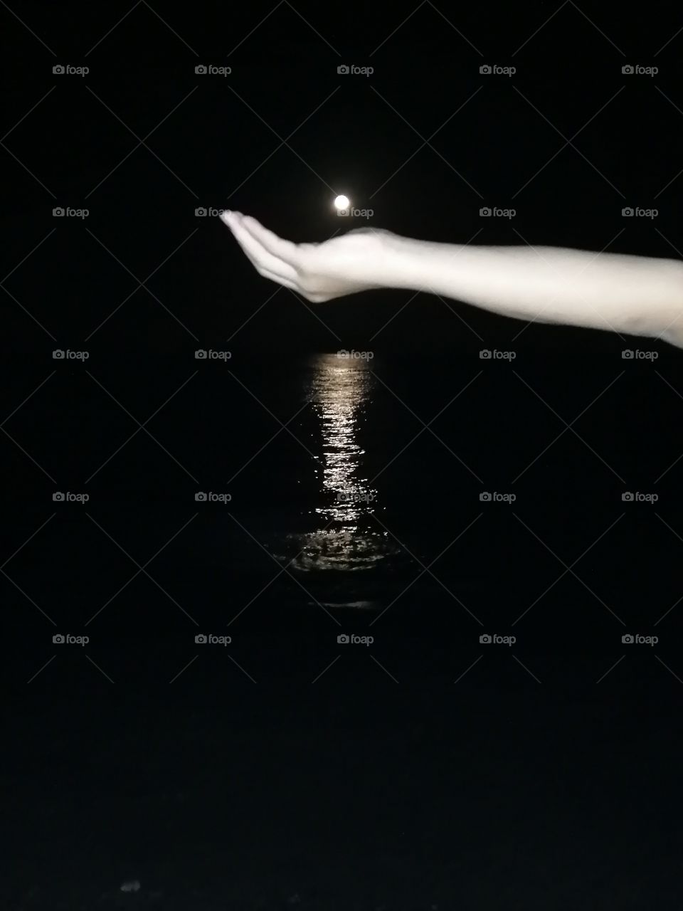 The moon reflected on the water.