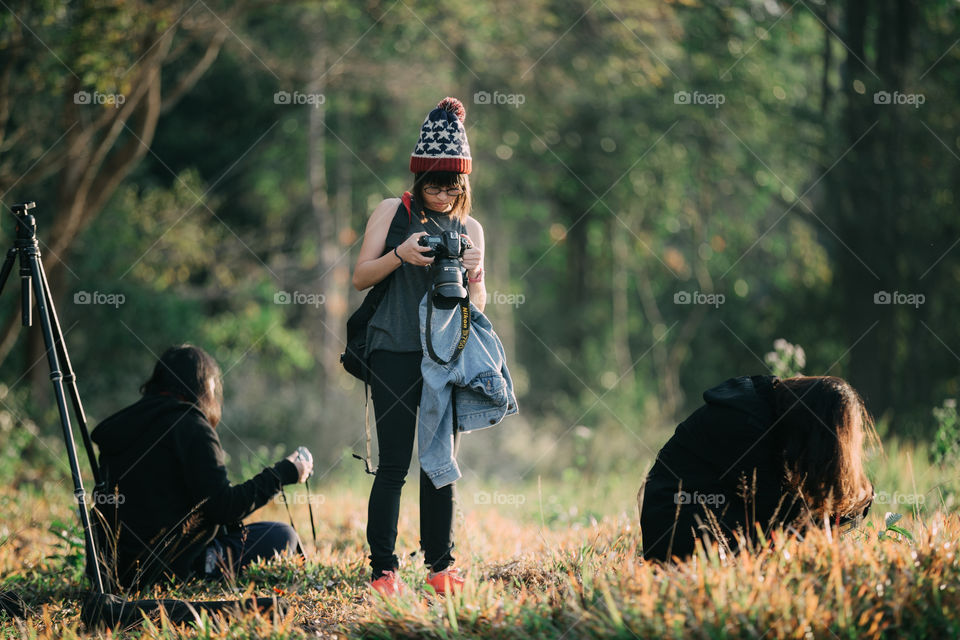 Female tourist photographer looking at the camera 