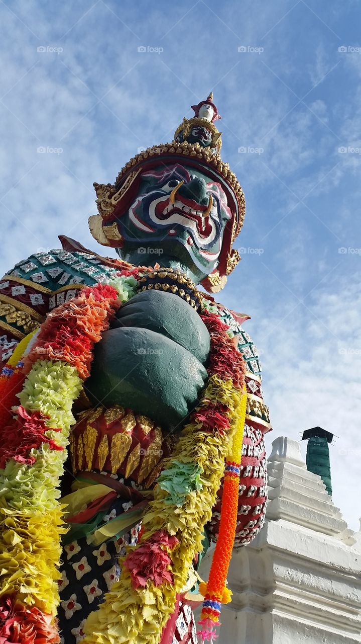Giant at the gate of temple in Lopburi Thailand