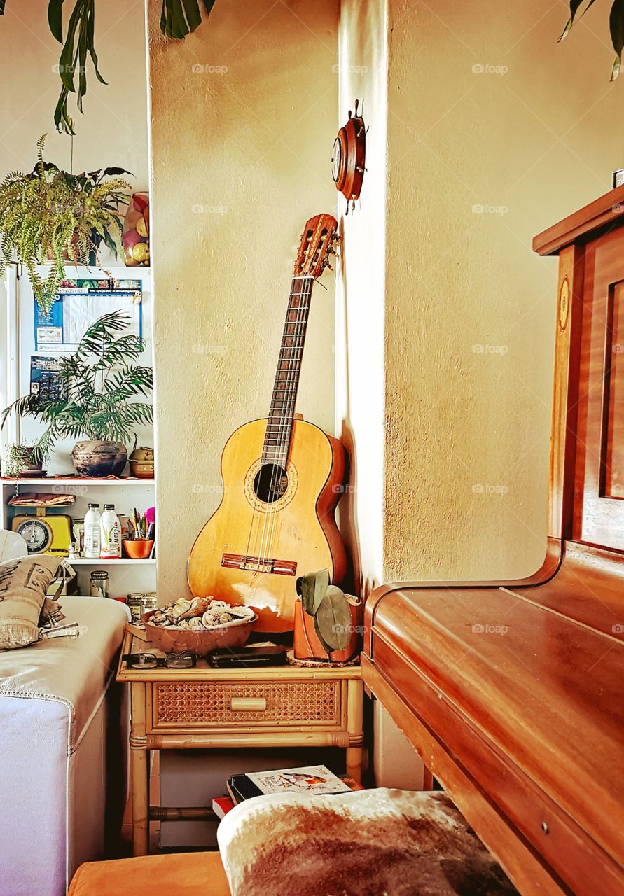 Guitar and piano in living room