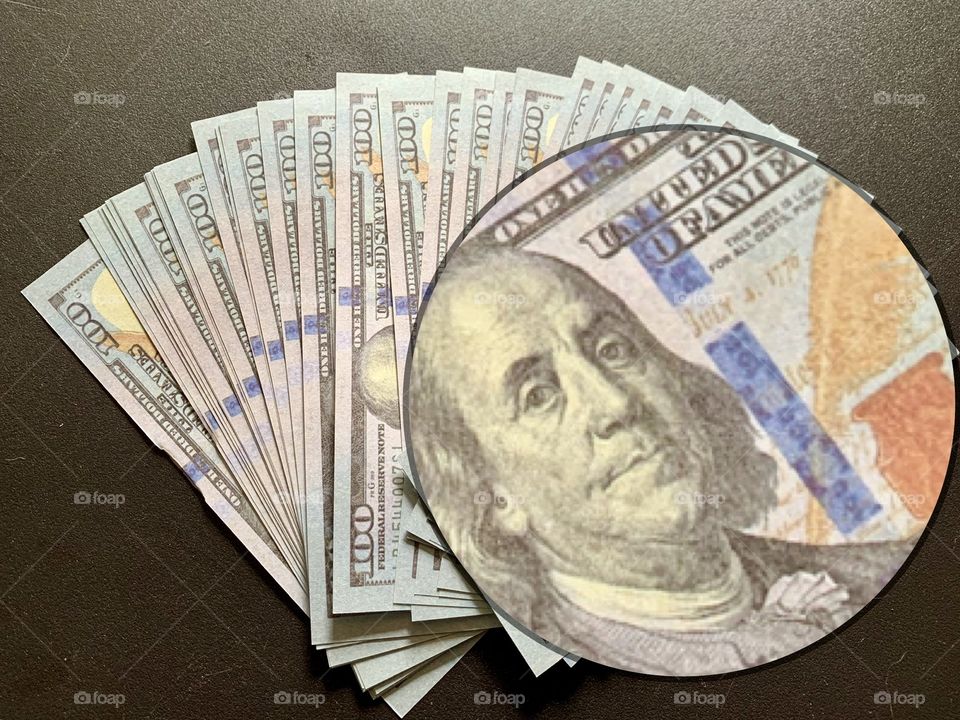 Benjamin Franklin hundred dollar bill bank note magnified money cash closeup 