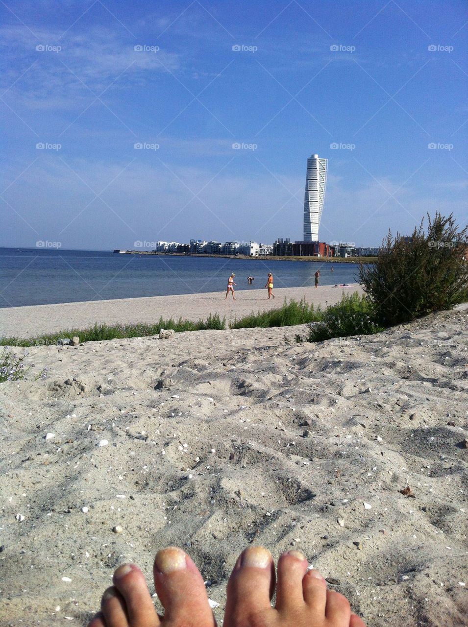 Sunbath on beach with Turning Torso