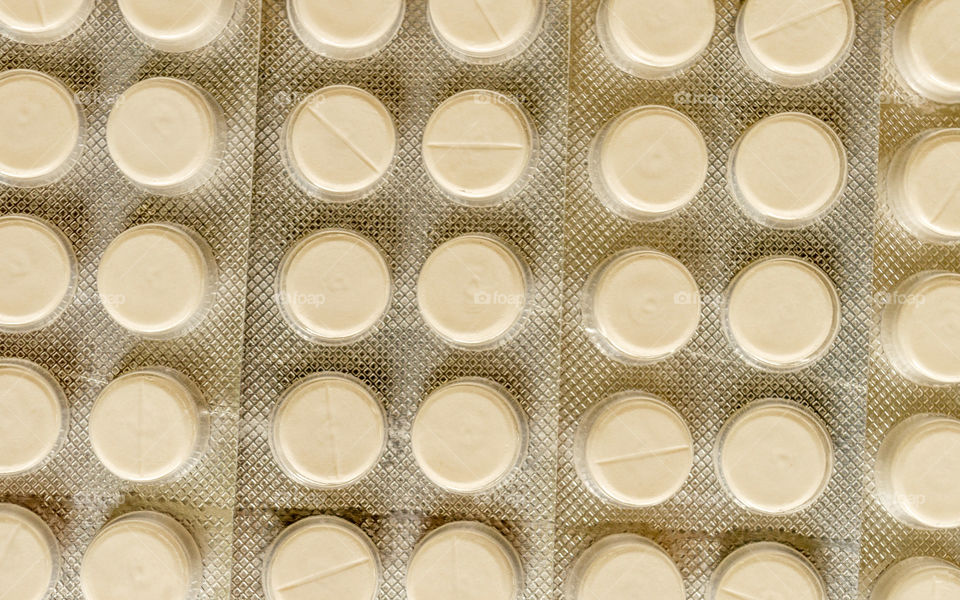 Closeup view Surface of pharmaceutic capsules medical drug antibiotics anti-bacteria pills tablets medicines. Pharmacy theme. Concept of taking health care and staying healthy medicinal use overdose.