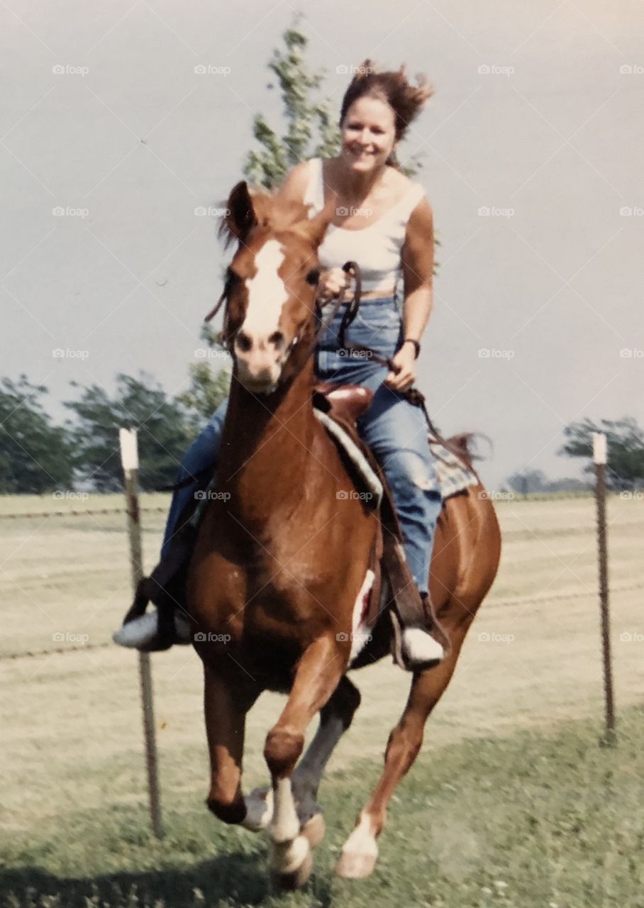Riding my first horse years ago.  I am posting this picture with the consent of my husband who took the picture. 