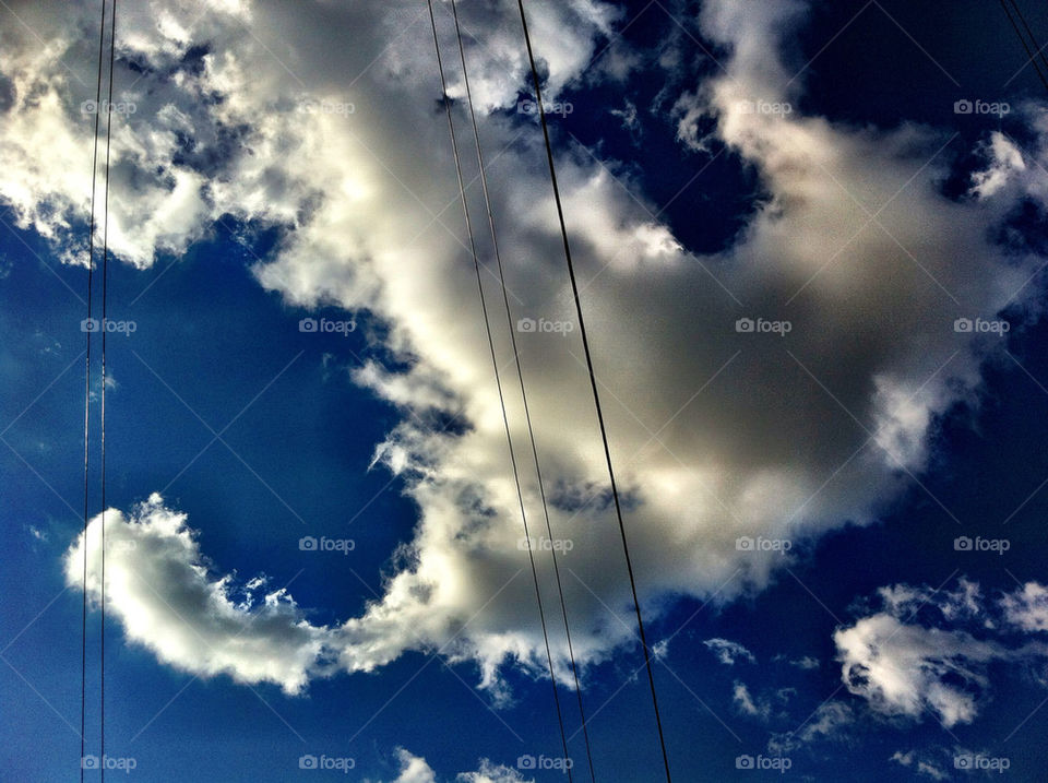 Clouds in the sky with wires