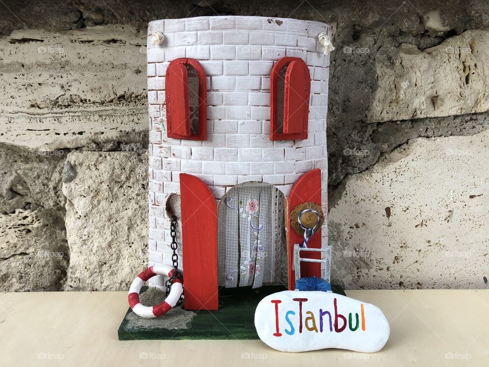 Istanbul, souvenir with an artistic tile and a colored stone