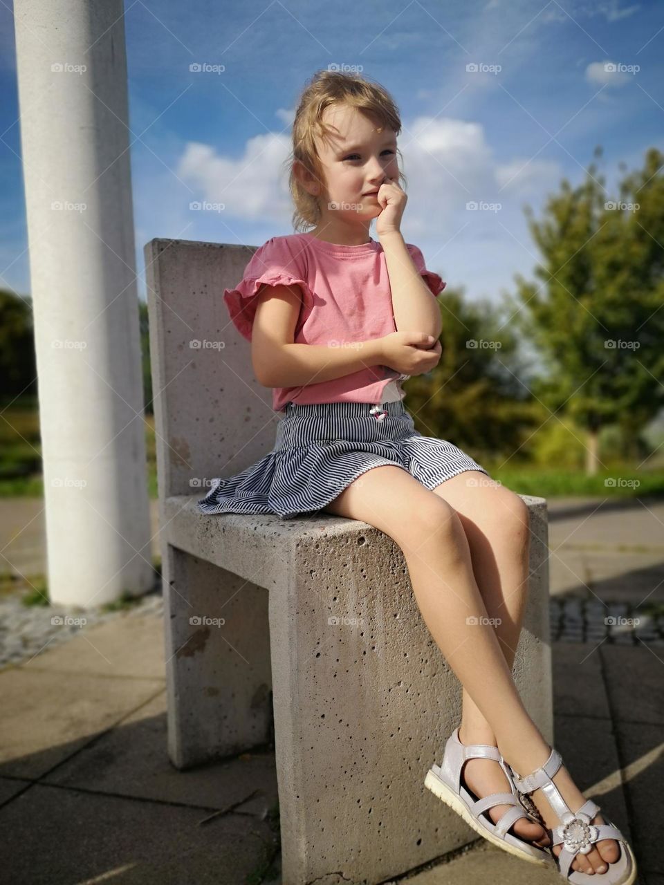 Daughter on a stone chair