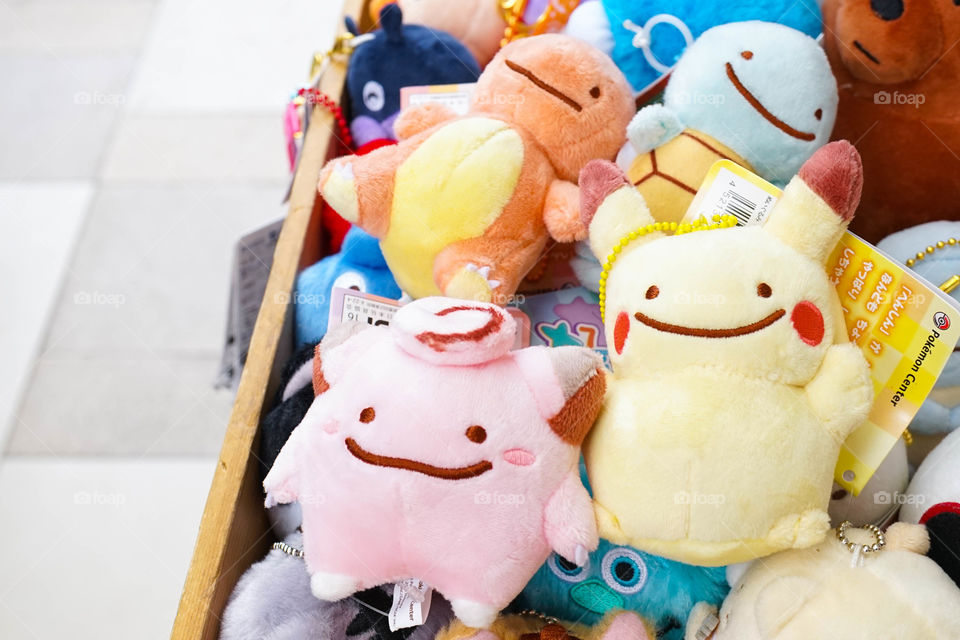 Bangkok, Thailand - September 16, 2017 : A pile of Pikachu and Pokemon friends stuffed animal plush dolls - Clefairy or Pippi (pink), Charmander or Hitokage (orange) and Squirtle or Zenigame (blue).