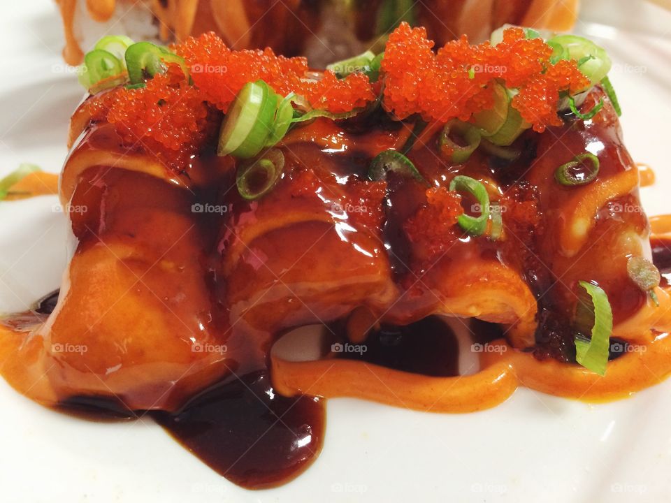 Seared Salmon Sushi. . Seared salmon belly topped with spicy mayo, eel sauce, scallions and masago. 