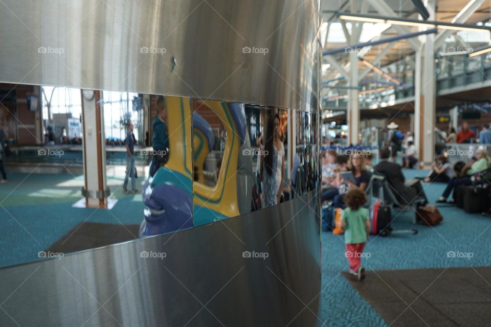 Curved mirror inside an airport lounge 