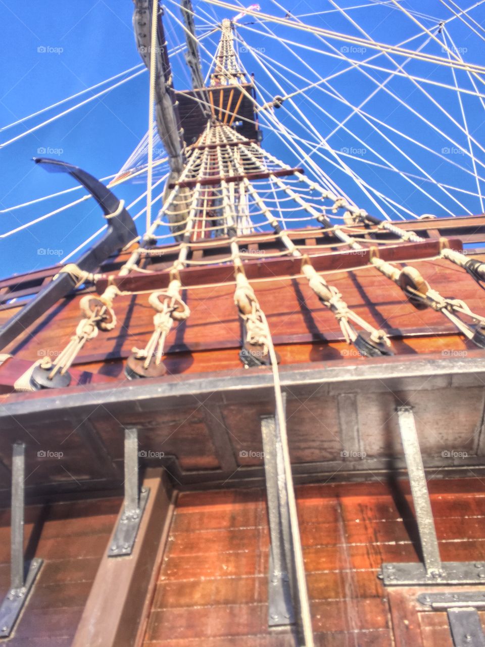 A pirates life . A rope ladder on an old ship 