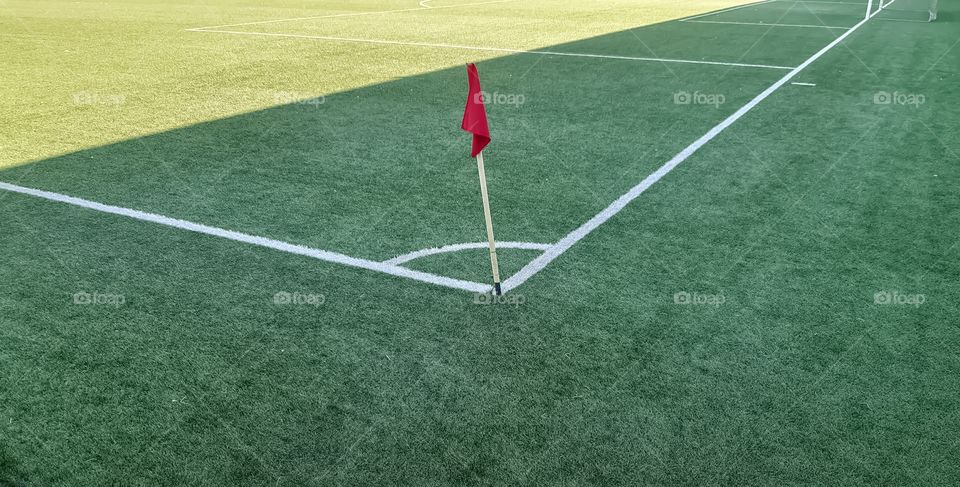 View from one of the corner flags of soccer pitch.
