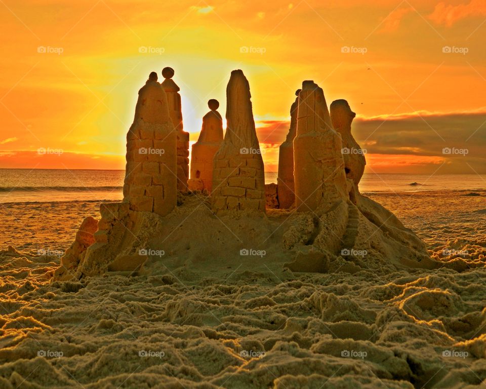 A sandcastle on the sandy beach - Light: Natural vs artificial vol 2. Light is the backbone of photography. Without light, there are no photos. After all, the word photo means light.