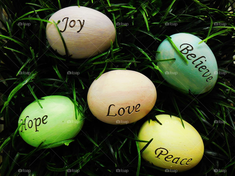 Joy Love Hope Believe Peace eggs on grass bright on dark