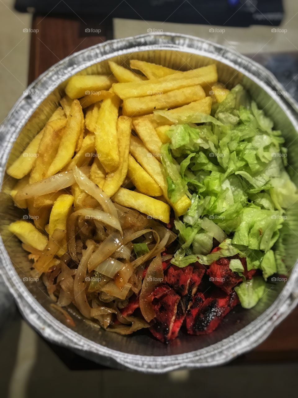 Sweet chili chicken, fried onions, lettuce and fries 