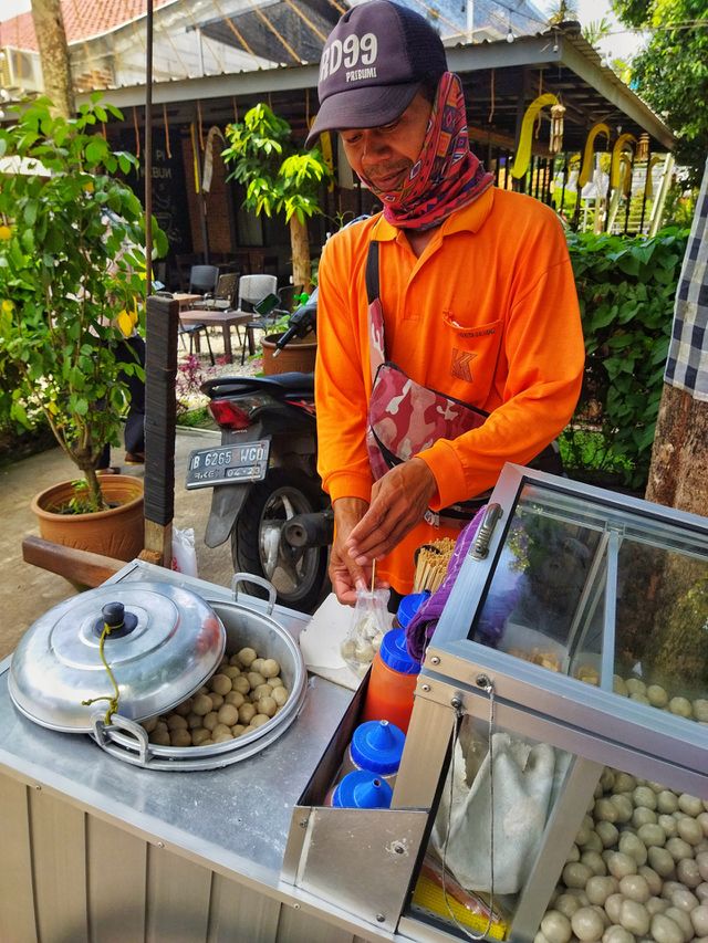 A street food vendor or cilok seller, Indonesian street food