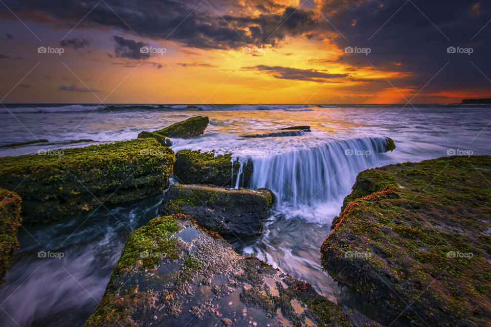 seascape rocky formation and motion waves