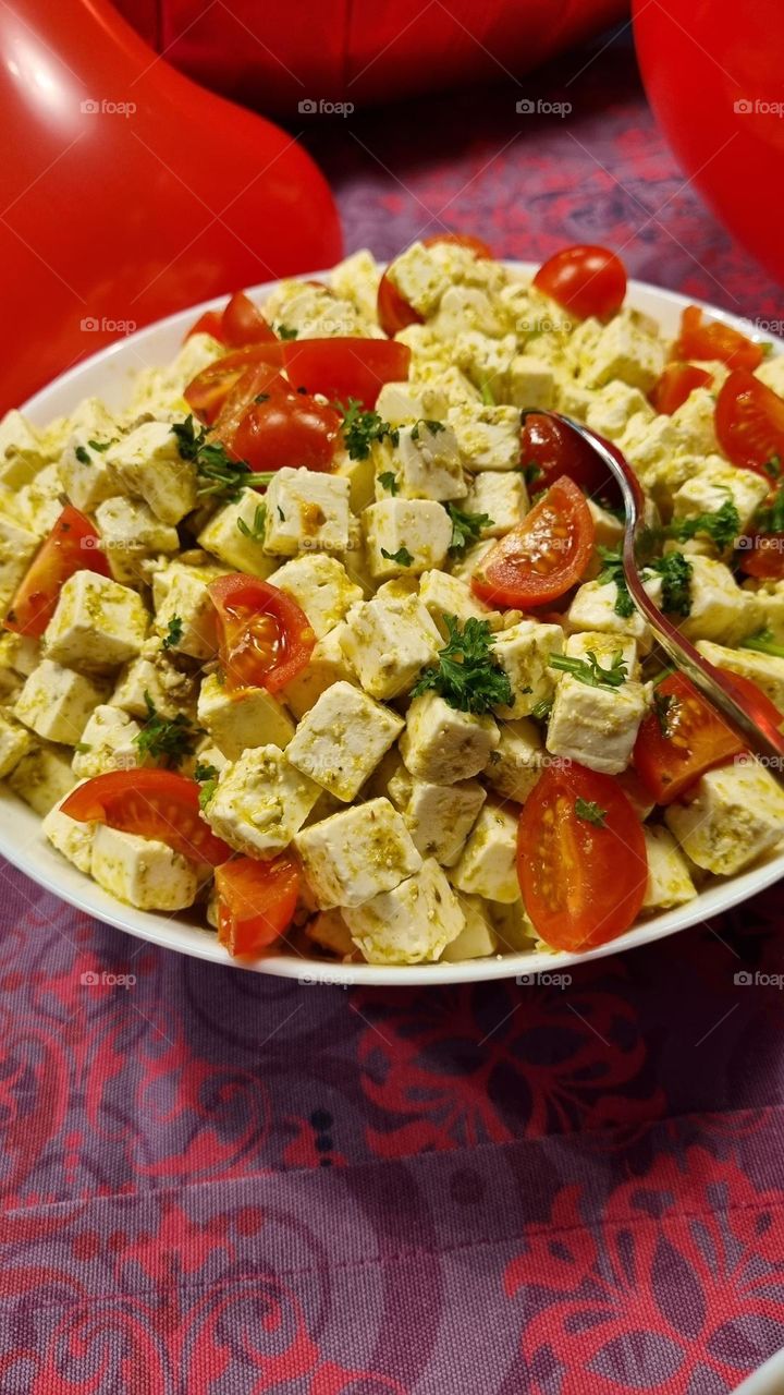 feta cheese marinated in pesto and tomato