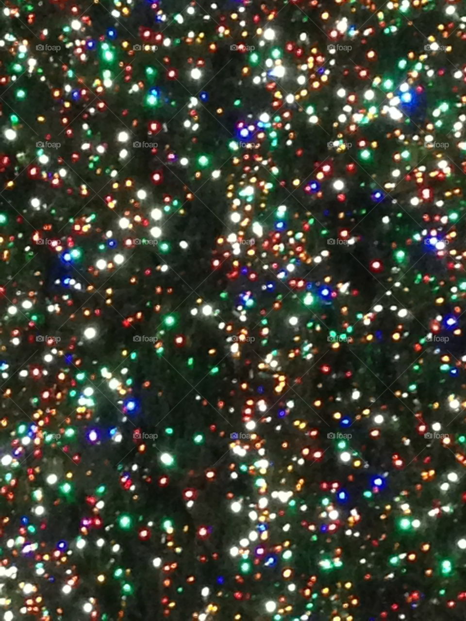 Close up of the colorful string lights on the Rockefeller Center Christmas tree in NYC New York City. 