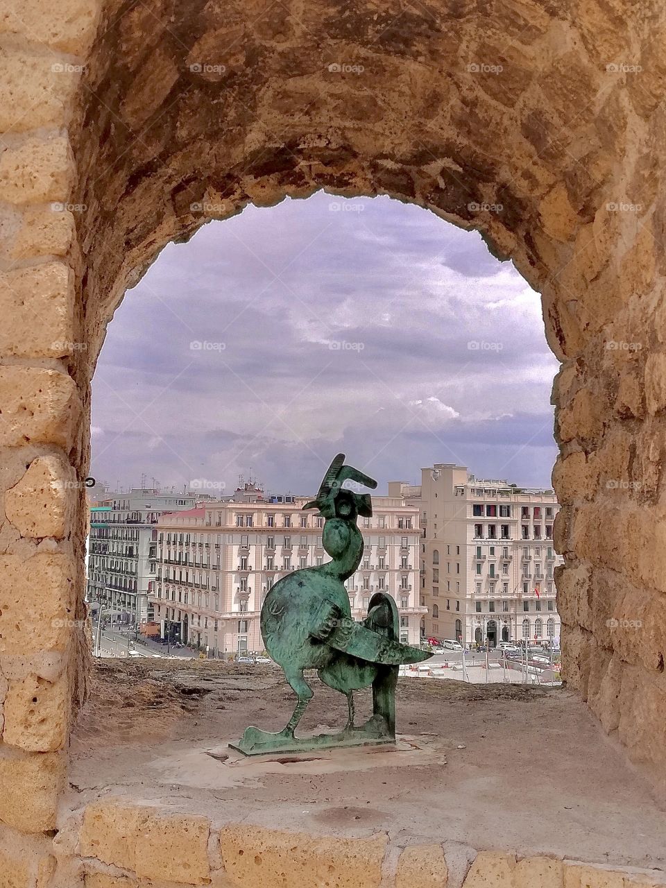 View of Naples of window castle with sculpture 