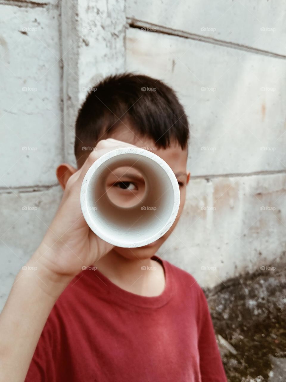 A boy with his rounders toy