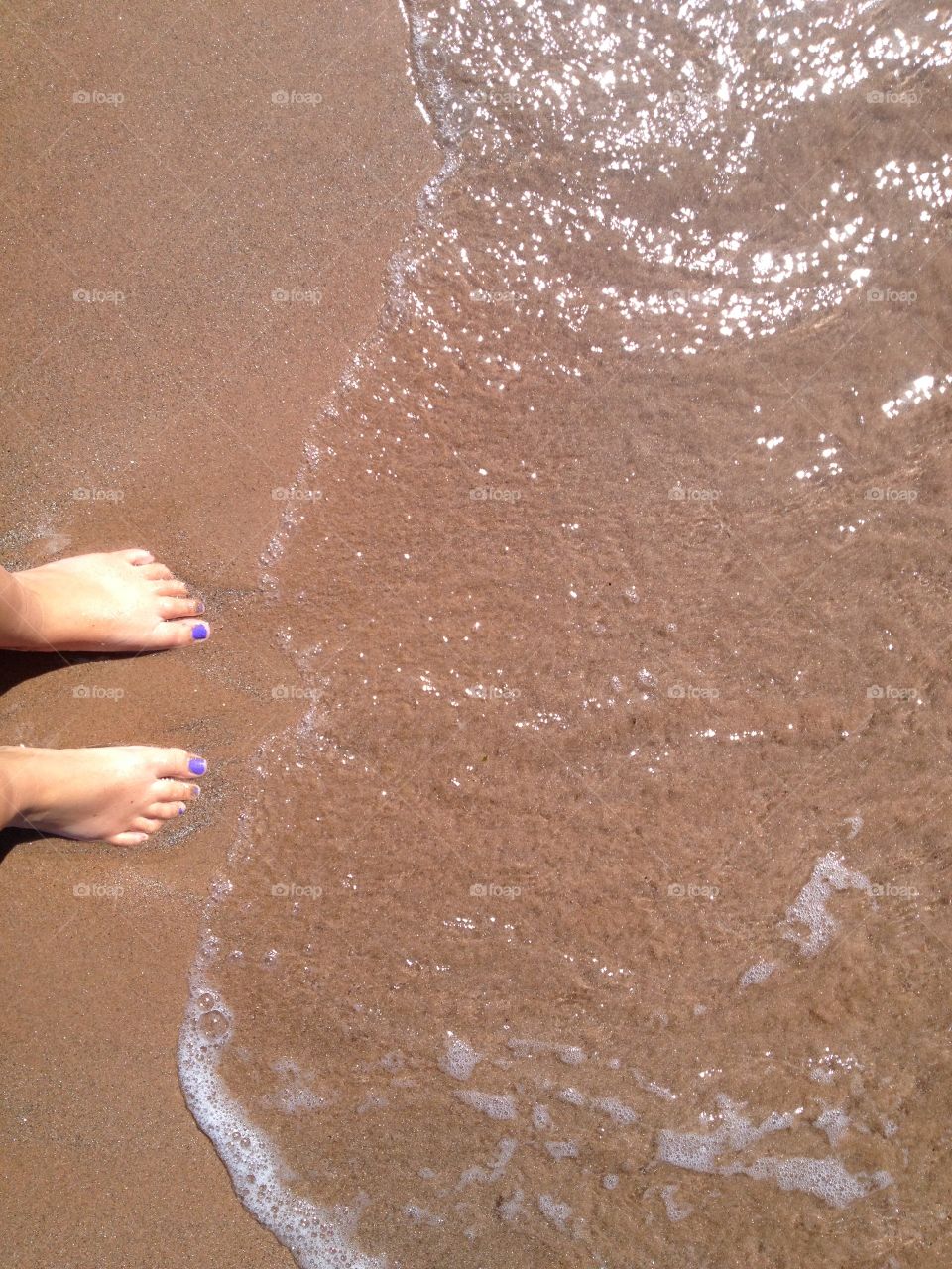 Standing on the beach getting wet feet is the best feeling in the world. A must every summer and on every travel / vacation 