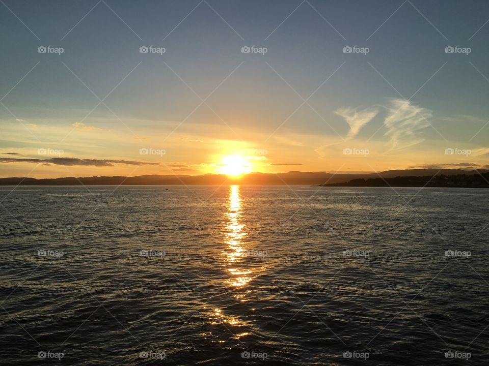 Reflection of orange sunset at sea