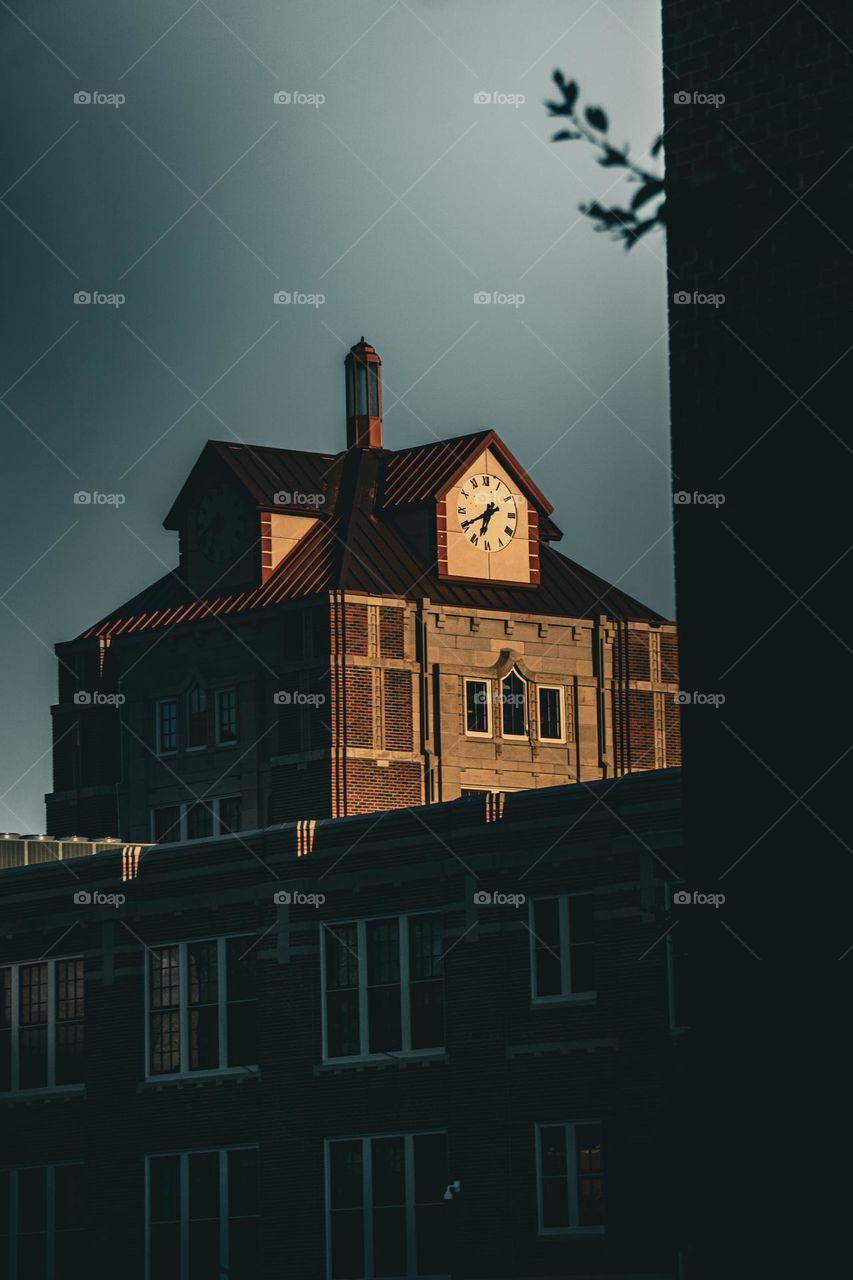 Clock tower cast into the light.