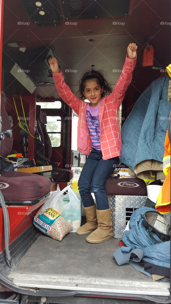 Daughter in ladder firetruck