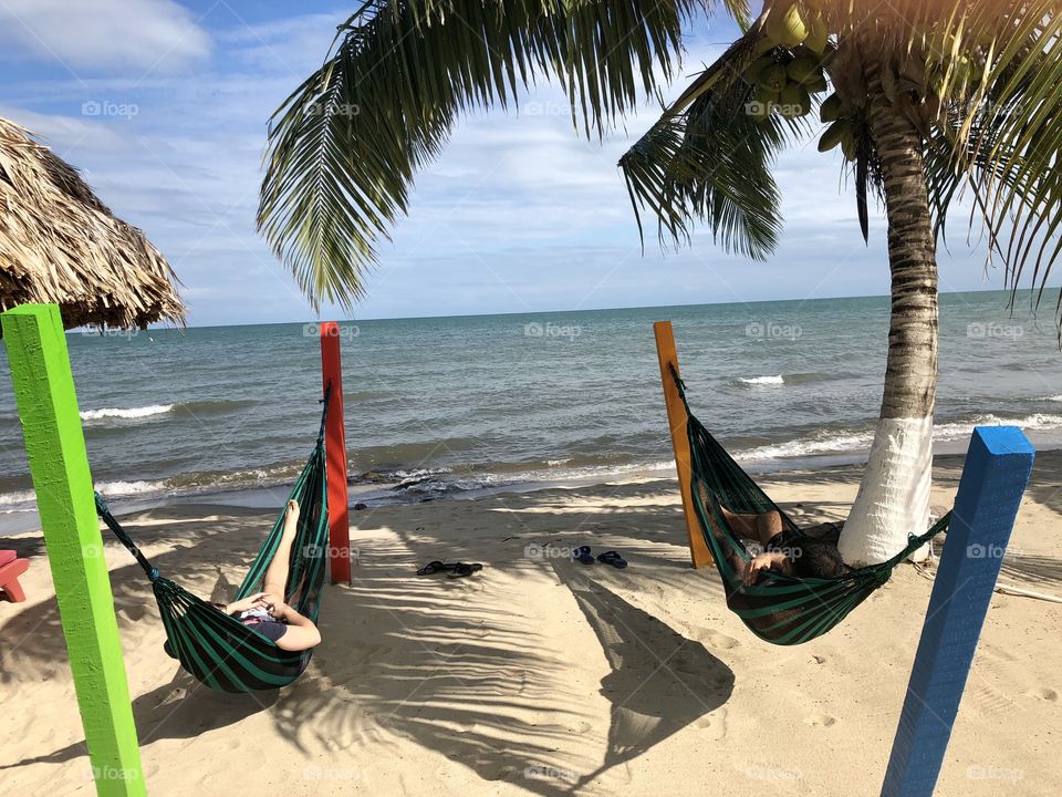 Belize Hopkins Bay friends In hammocks 