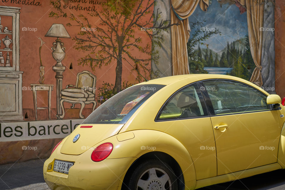 Graffiti shop and yellow car