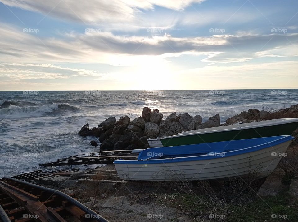 Winter waves and low sun over the sea