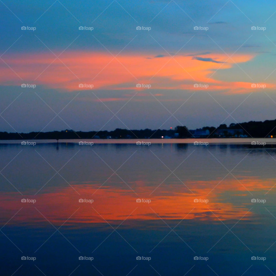 The sun is blushing today. Nimble ripples dance across the water, clear as glass, speckled with gold dust. It's reaction to the sun is fascinating! After being mesmerized temporarily, I proceed to do what I came to do, capture it's short term beauty