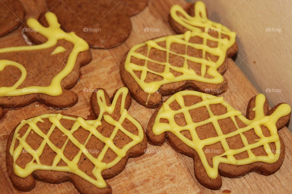 cookies yellow gingerbread bunnies on a wooden background