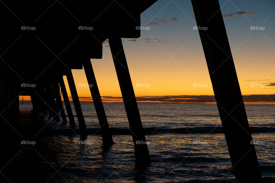 Sunset through the pier