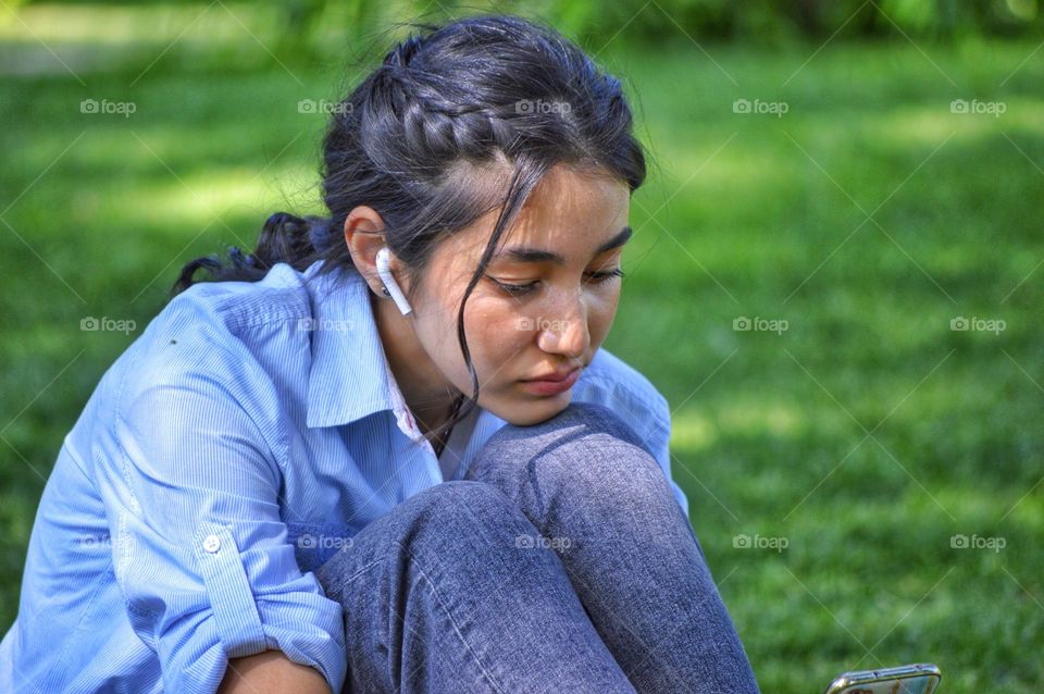 girl with a beautiful hairstyle and a headphone