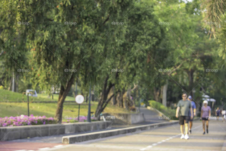 Blurry image people running exercise for health in the Benjakitti Park , Bangkok in Thailand.