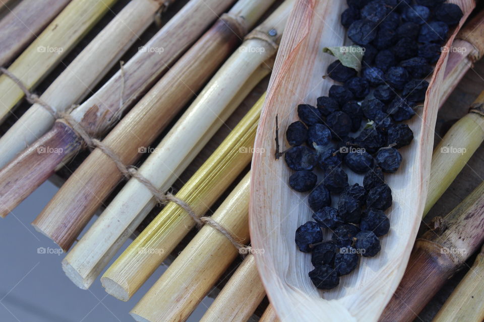 bamboo table with exotic black berries