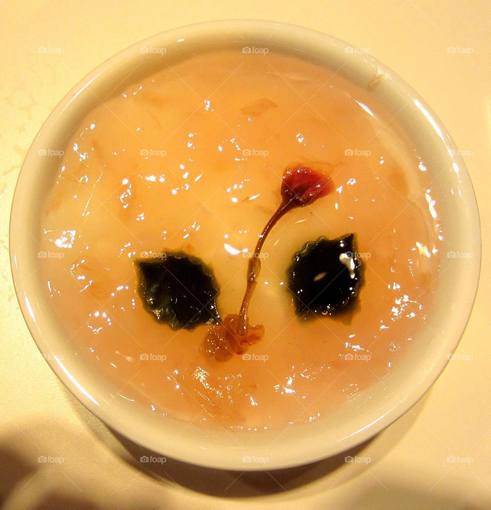 bowl of pink sakura cherry blossom dessert jelly in spring time in Japan