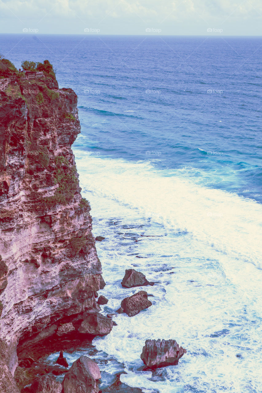 Beautiful cliffs meeting the ocean  in Bali.