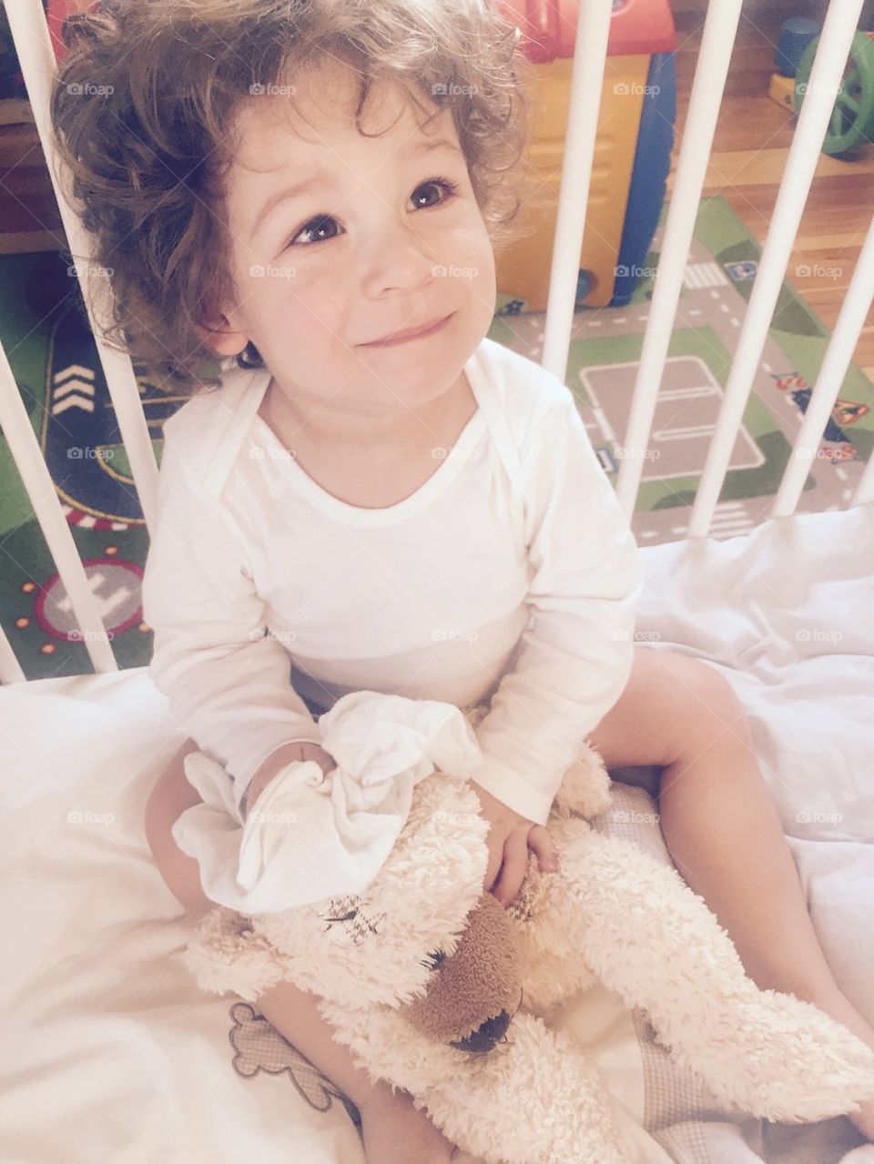 Smiling Boy in his Bed