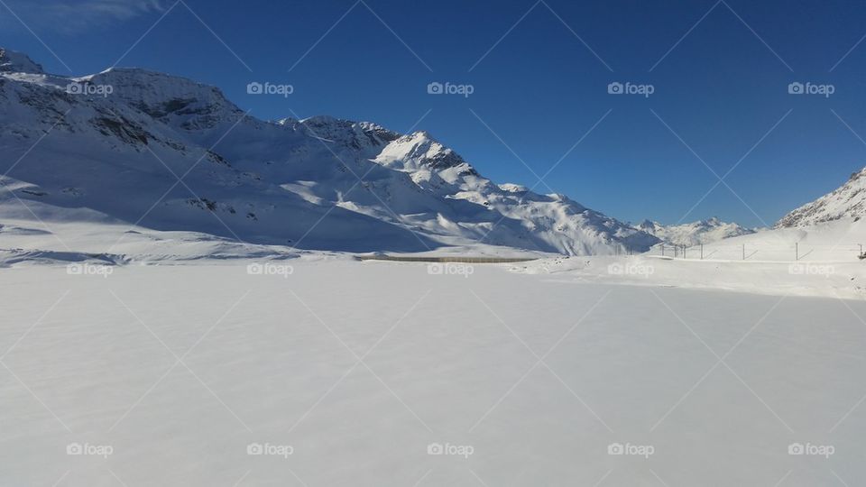 Snowcapped mountain against clear sky