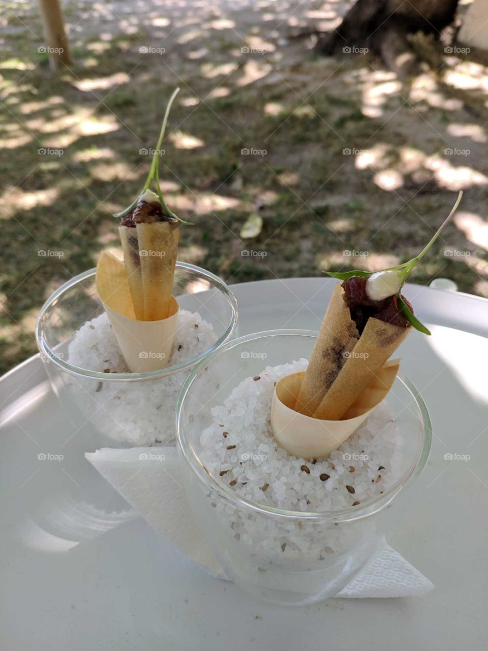 Two equal appetizers served on the beach