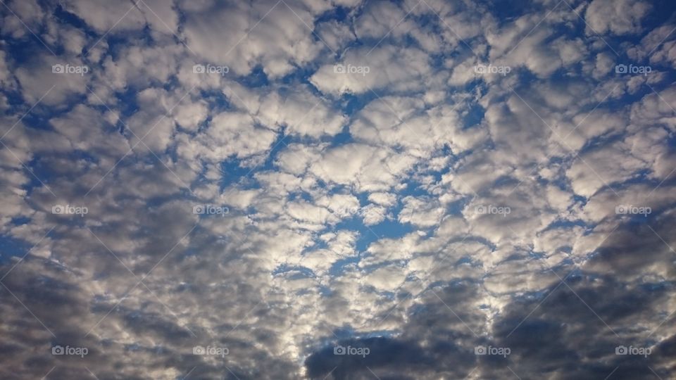 Low angle view of fluffy clouds