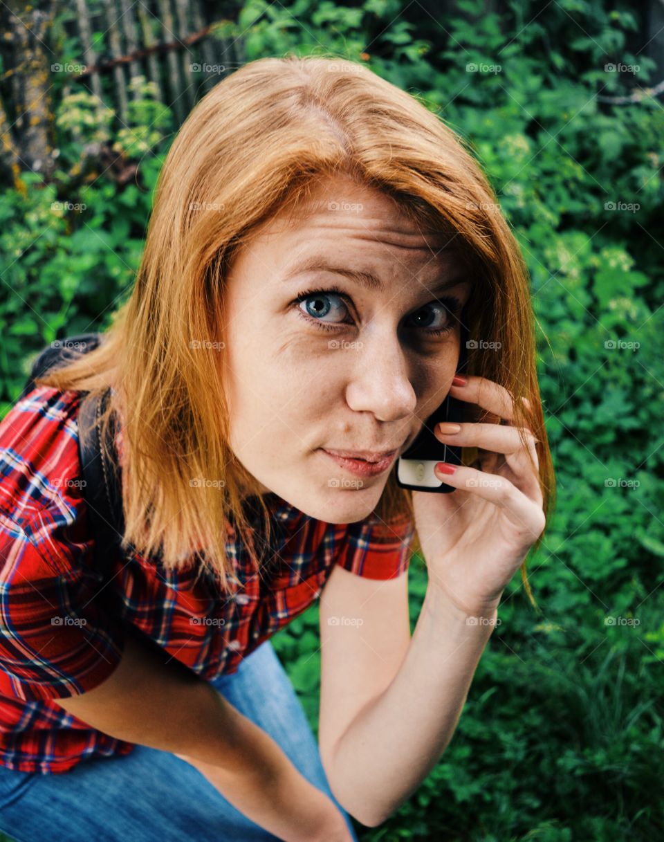 Girl calling with telephone