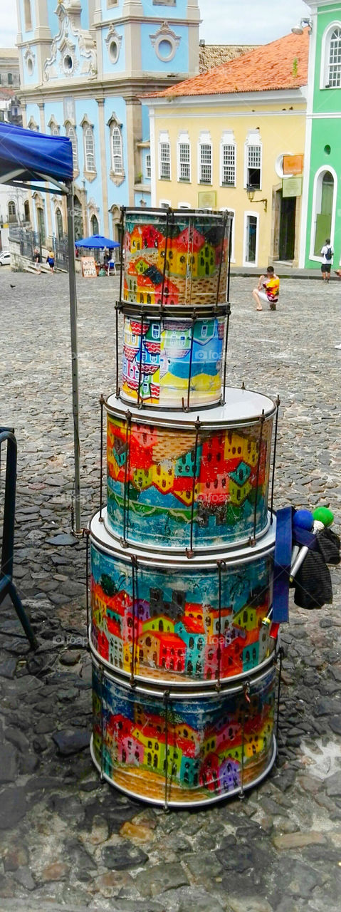 Pop of color . Drums in the street with coloured houses . Salvador, Brazil 